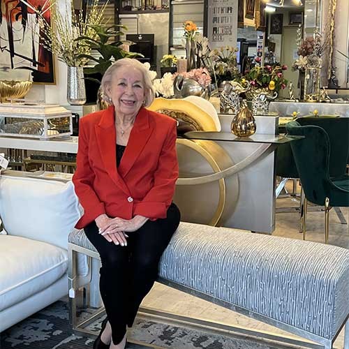 Smiling woman sitting in a decorated room